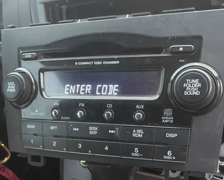 Honda CR-V 6-CD changer radio display showing ENTER CODE